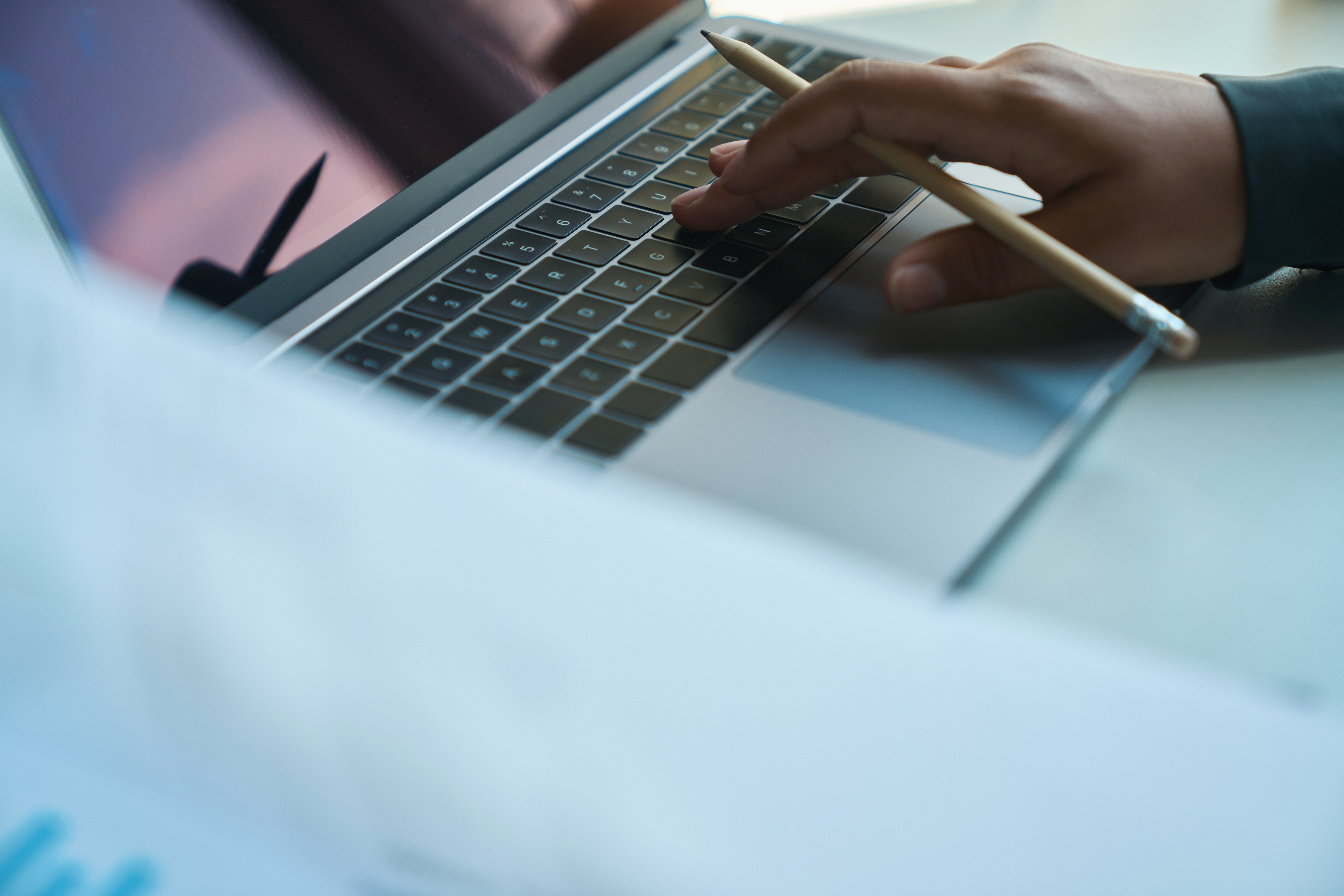 close-up-of-hand-pressing-keys-on-laptop-keyboard-2023-11-27-04-56-31-utc.jpg