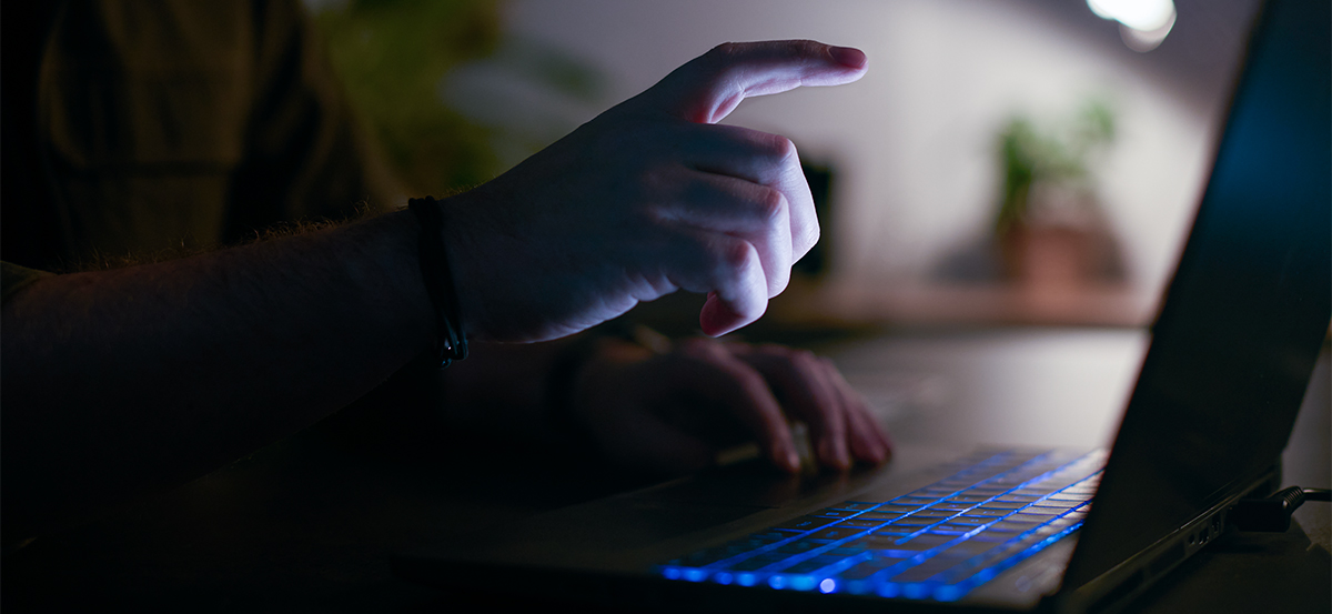 close-up-of-man-using-laptop-at-home-at-night-with-2024-10-19-11-55-30-utc.jpg