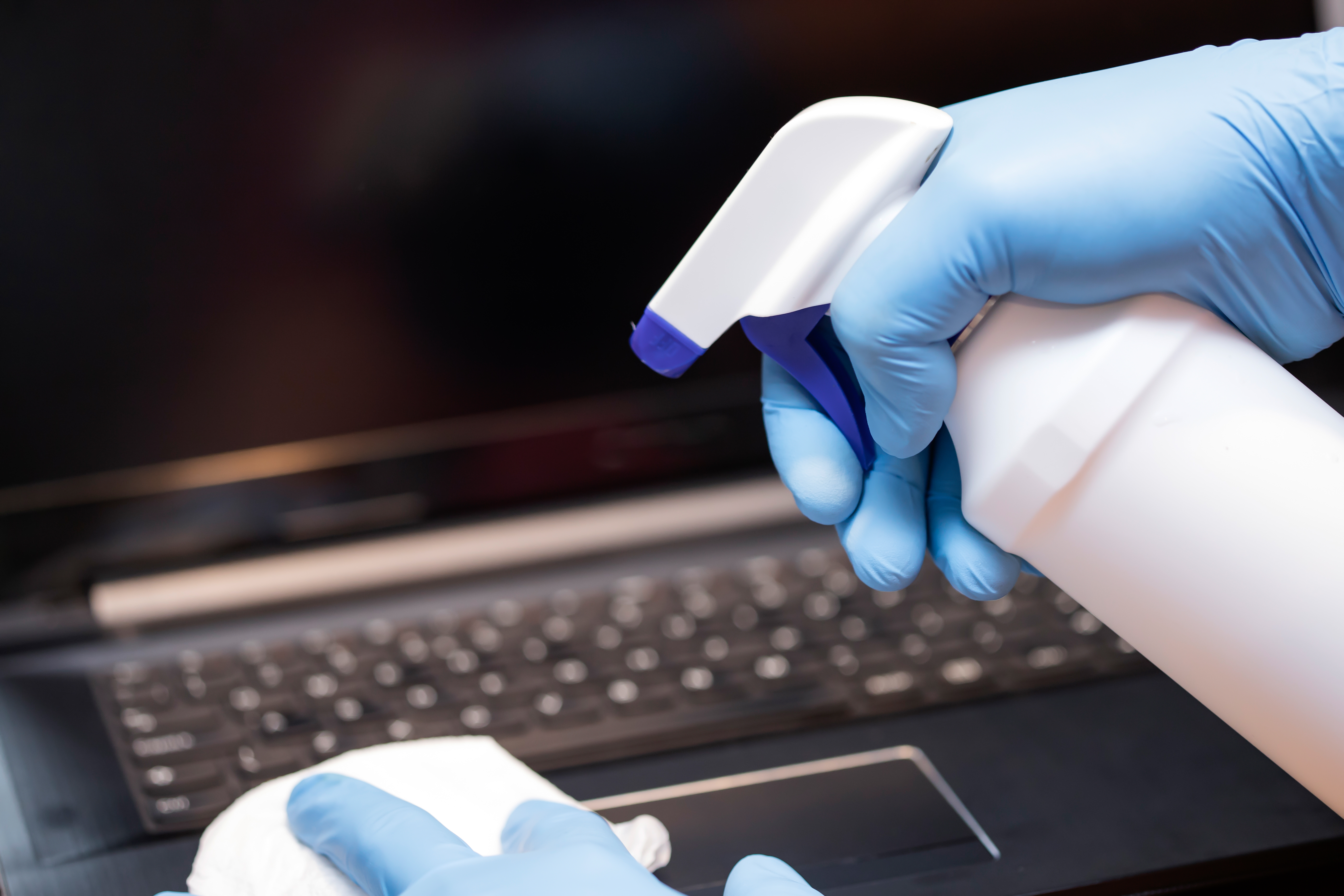 hands-cleaning-laptop-computer-to-avoid-coronaviru-2023-11-27-05-20-25-utc.jpg